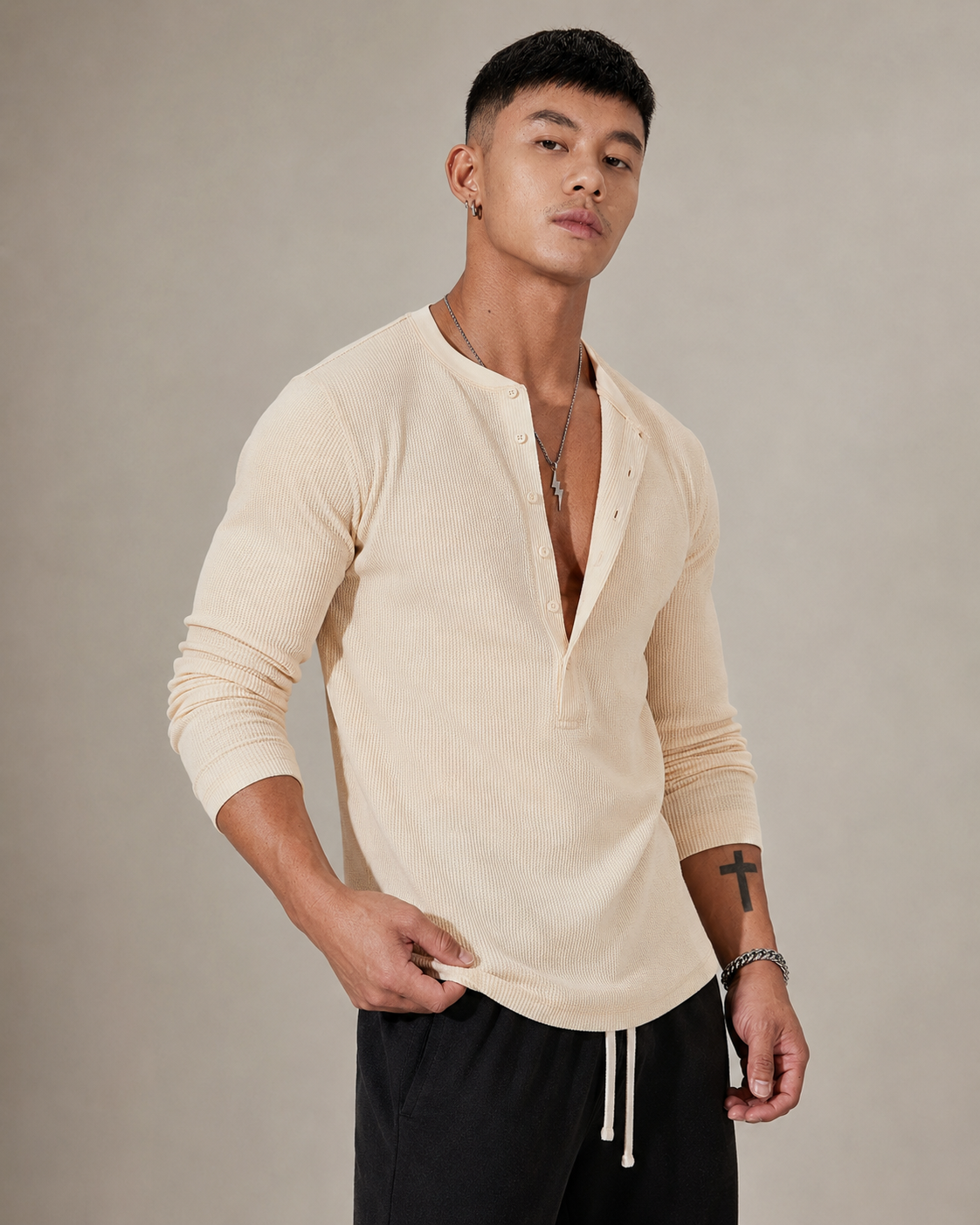 Camisola de malha canelada de manga comprida e meio fecho de botões