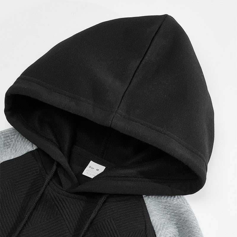 Herrhoodie med texturerade kontrastpaneler